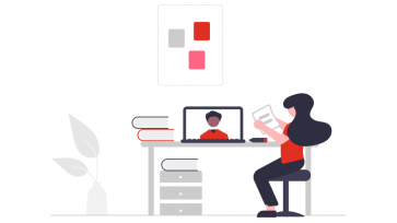 woman looking at computer with person on it