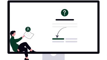 student in front of large computer